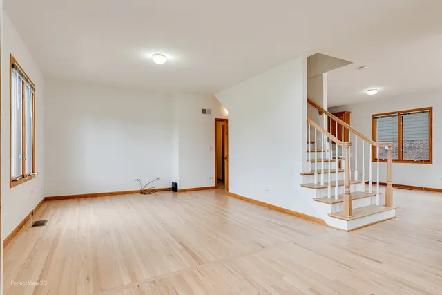 a view of an empty room with stairs