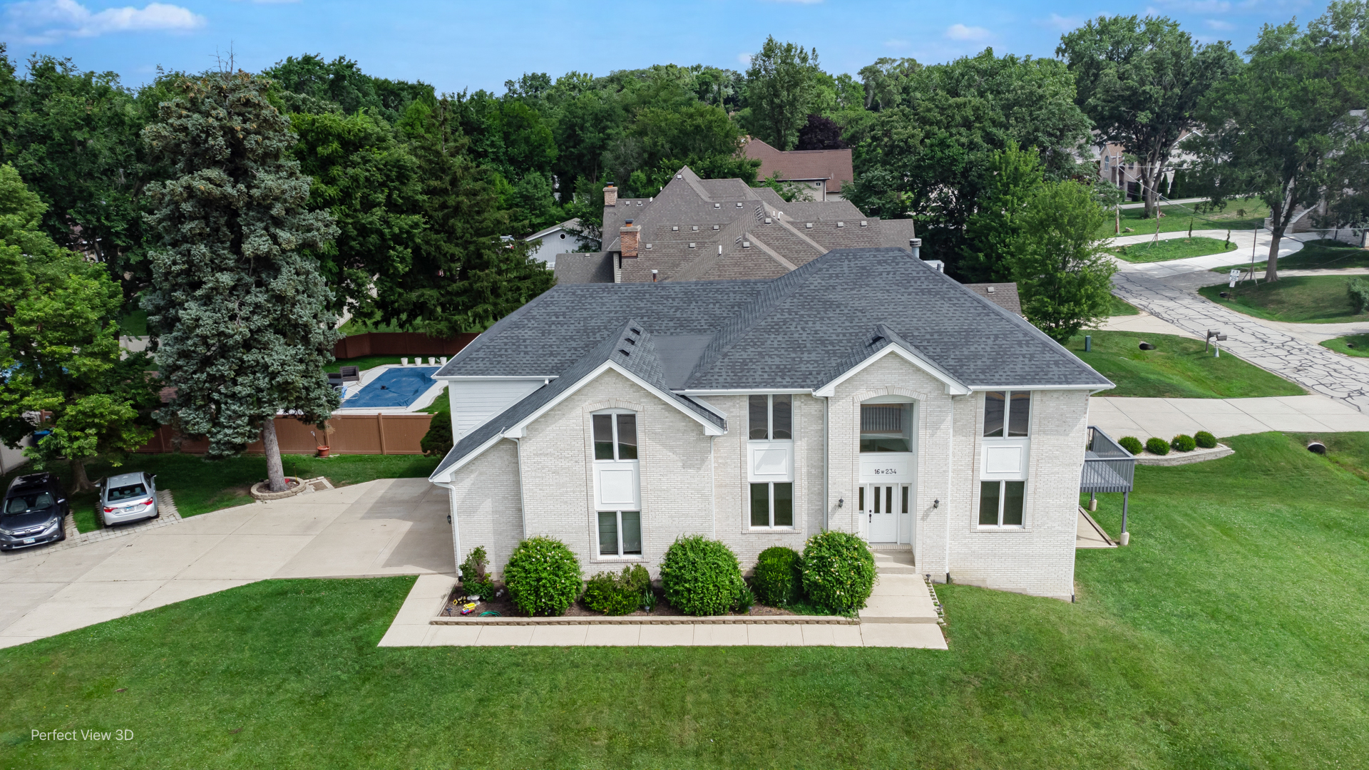 16W234 91st Street Burr Ridge, IL 60527 - Photo 2 of 31 a view of house with garden