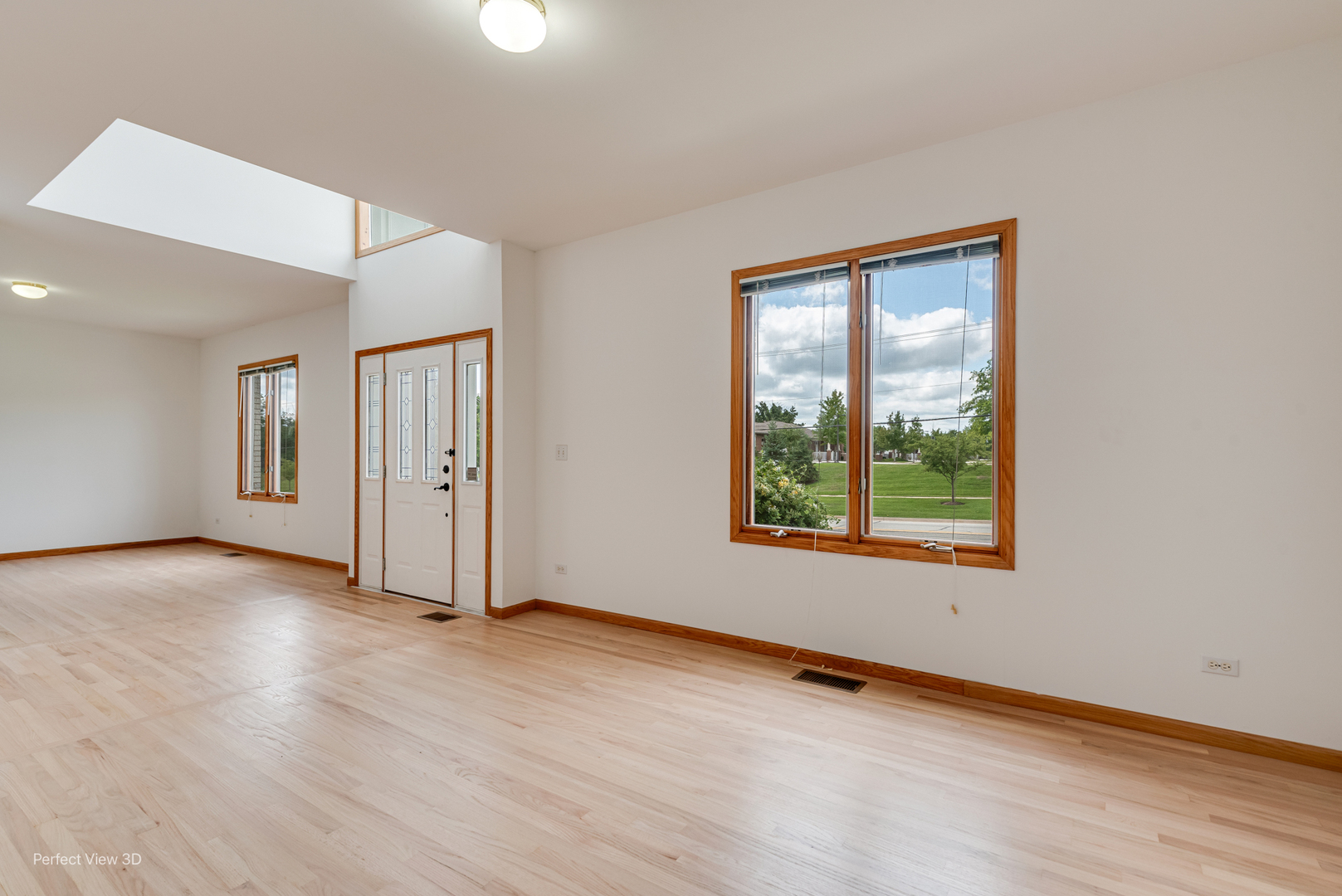 16W234 91st Street Burr Ridge, IL 60527 - Photo 8 of 31 an empty room with wooden floor and windows
