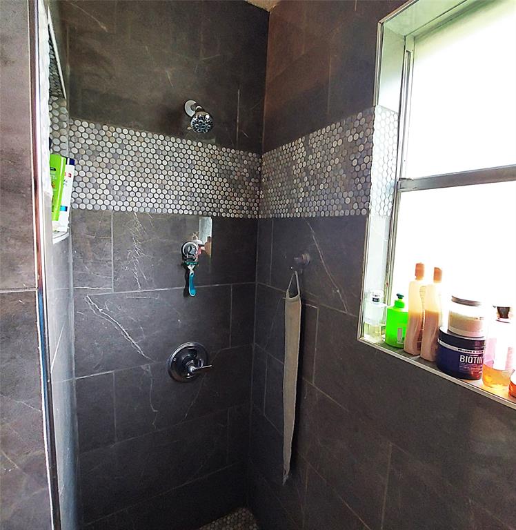 2303 Dover Road Killeen, TX 76543 - Photo 9 of 18 Guest Bathroom featuring a Tiled Shower.
