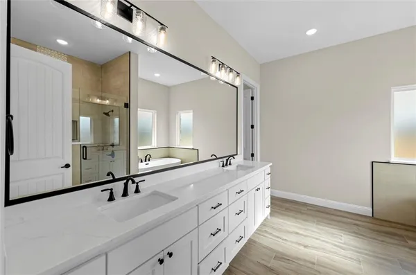 a bathroom with a bathtub and a sink