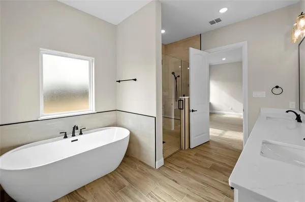 a white bath tub sitting in a bathroom