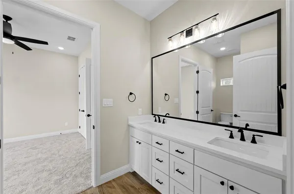 a view of a room with wooden floor