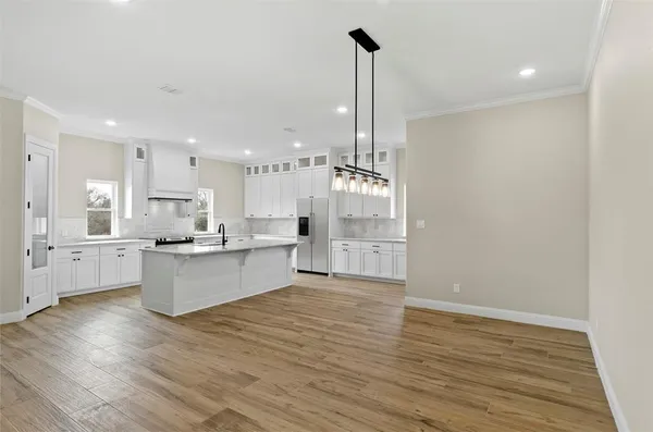 a view of kitchen with wooden floor