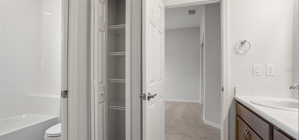 7550 Southwest 107th Lane Ocala, FL 34476 - Photo 15 of 22 a bathroom with a granite countertop sink toilet and shower