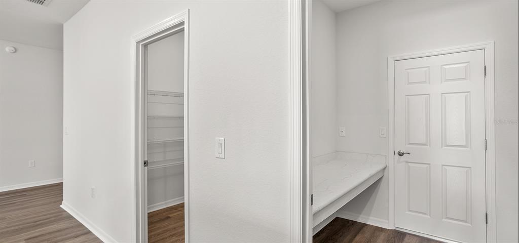 7550 Southwest 107th Lane Ocala, FL 34476 - Photo 16 of 22 a view of a hallway with the wooden floor