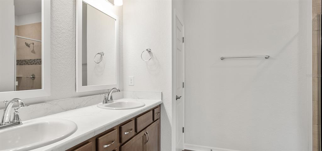 7550 Southwest 107th Lane Ocala, FL 34476 - Photo 17 of 22 a bathroom with a sink and a mirror