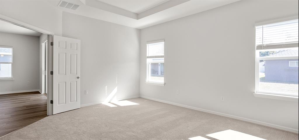 7550 Southwest 107th Lane Ocala, FL 34476 - Photo 19 of 22 a view of empty room with wooden floor and fan