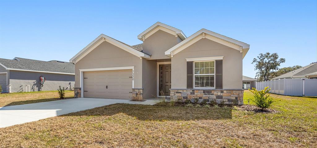 7550 Southwest 107th Lane Ocala, FL 34476 - Photo 2 of 22 a view of a house with a yard