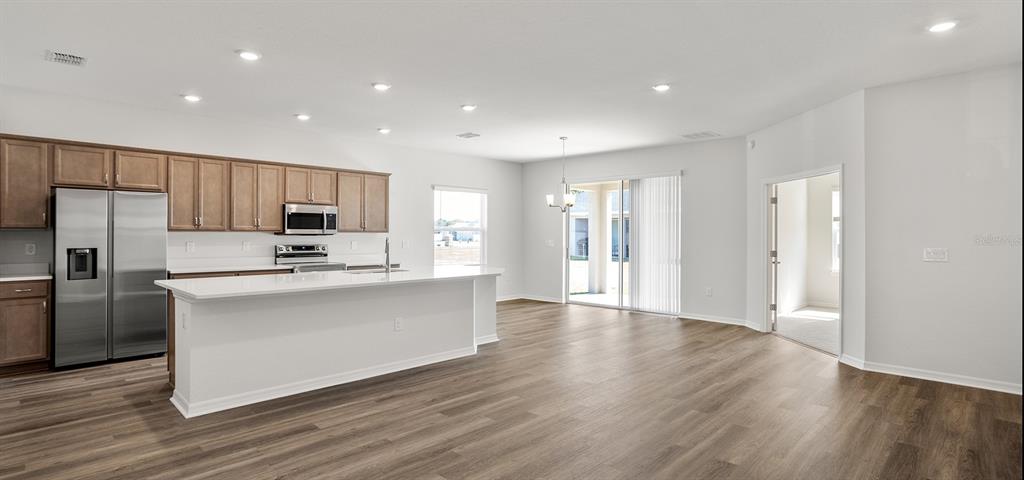 7550 Southwest 107th Lane Ocala, FL 34476 - Photo 5 of 22 a kitchen with stainless steel appliances a refrigerator sink and cabinets