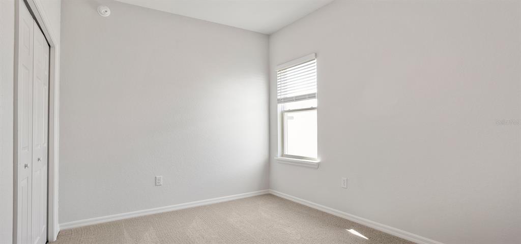 7550 Southwest 107th Lane Ocala, FL 34476 - Photo 10 of 22 an empty room with windows