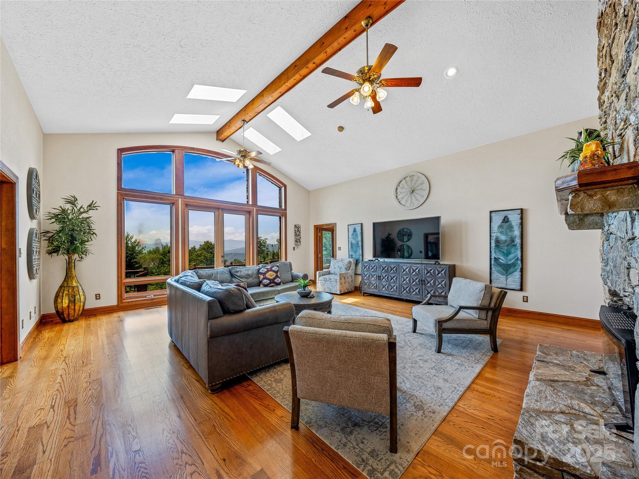 514 Lab Mountain Trail Clyde, NC 28721 - Photo 11 of 37 a living room with furniture and a large window