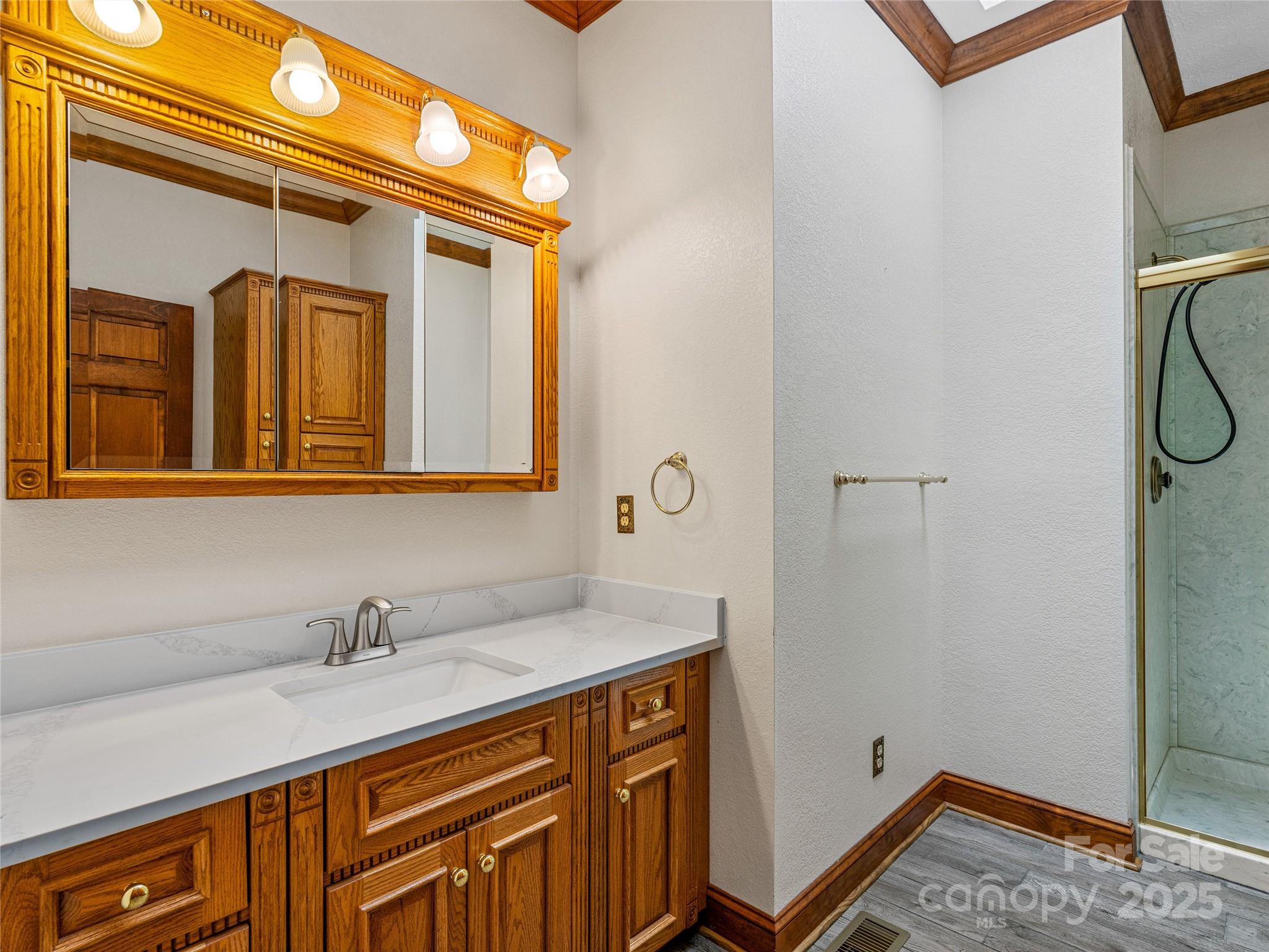 514 Lab Mountain Trail Clyde, NC 28721 - Photo 21 of 37 a bathroom with a sink and a mirror