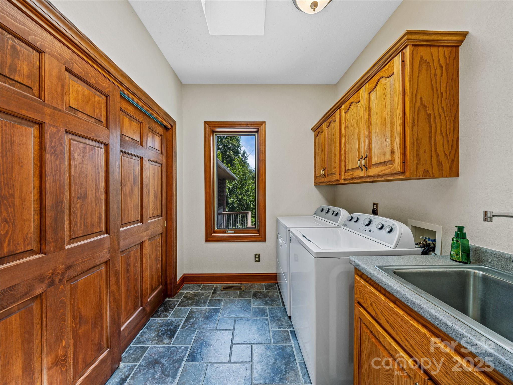 514 Lab Mountain Trail Clyde, NC 28721 - Photo 24 of 37 a utility room with dryer and washer