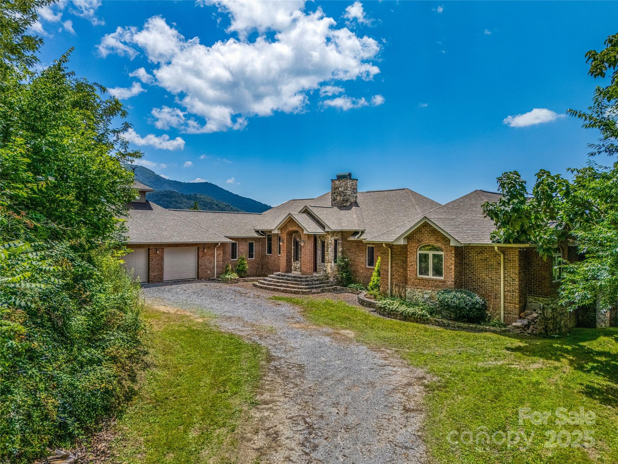 514 Lab Mountain Trail Clyde, NC 28721 - Photo 3 of 37 a front view of a house with garden