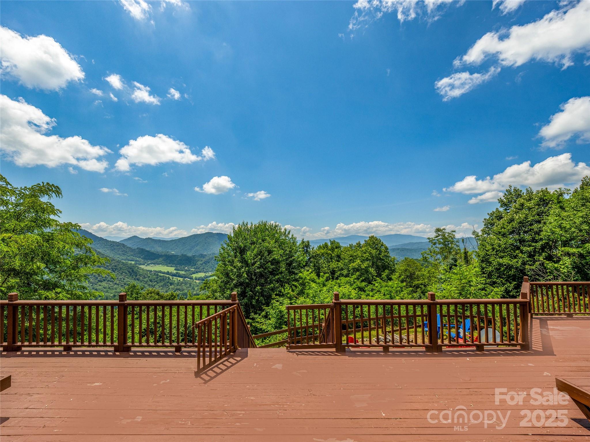 514 Lab Mountain Trail Clyde, NC 28721 - Photo 33 of 37 a view of a balcony with a swing