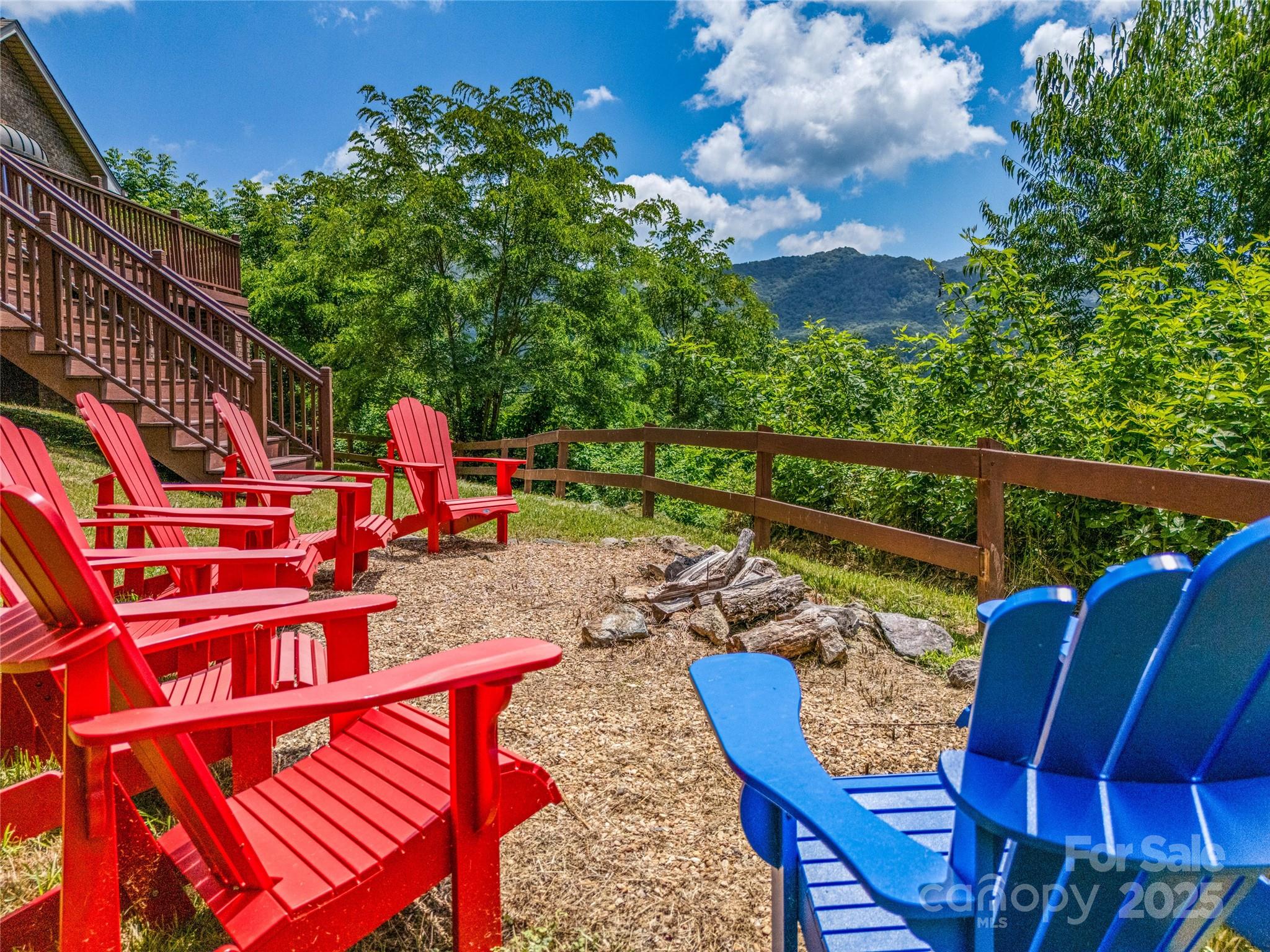 514 Lab Mountain Trail Clyde, NC 28721 - Photo 34 of 37 a view of a chairs and table in the outdoor