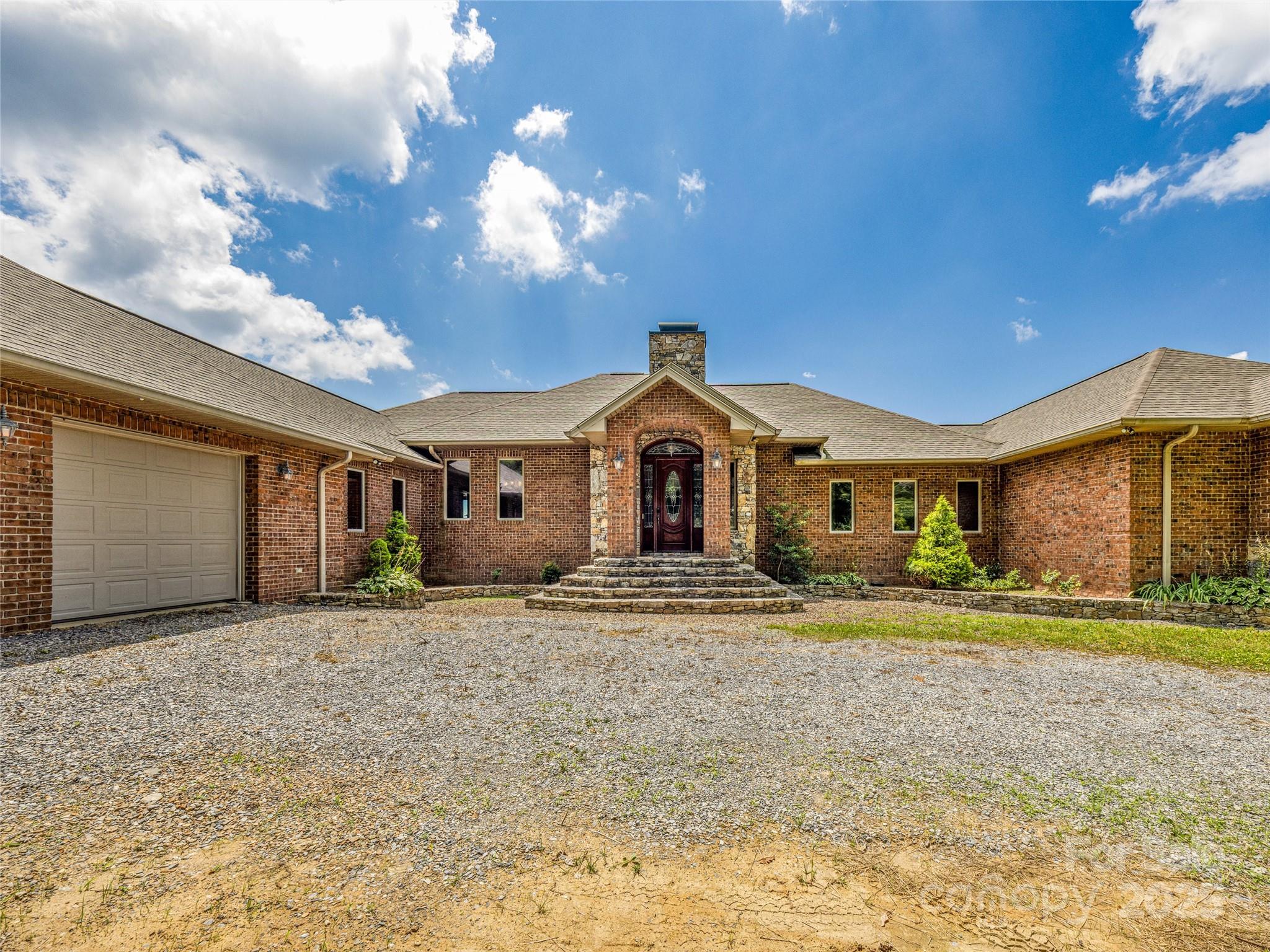 514 Lab Mountain Trail Clyde, NC 28721 - Photo 4 of 37 a front view of a house with a yard