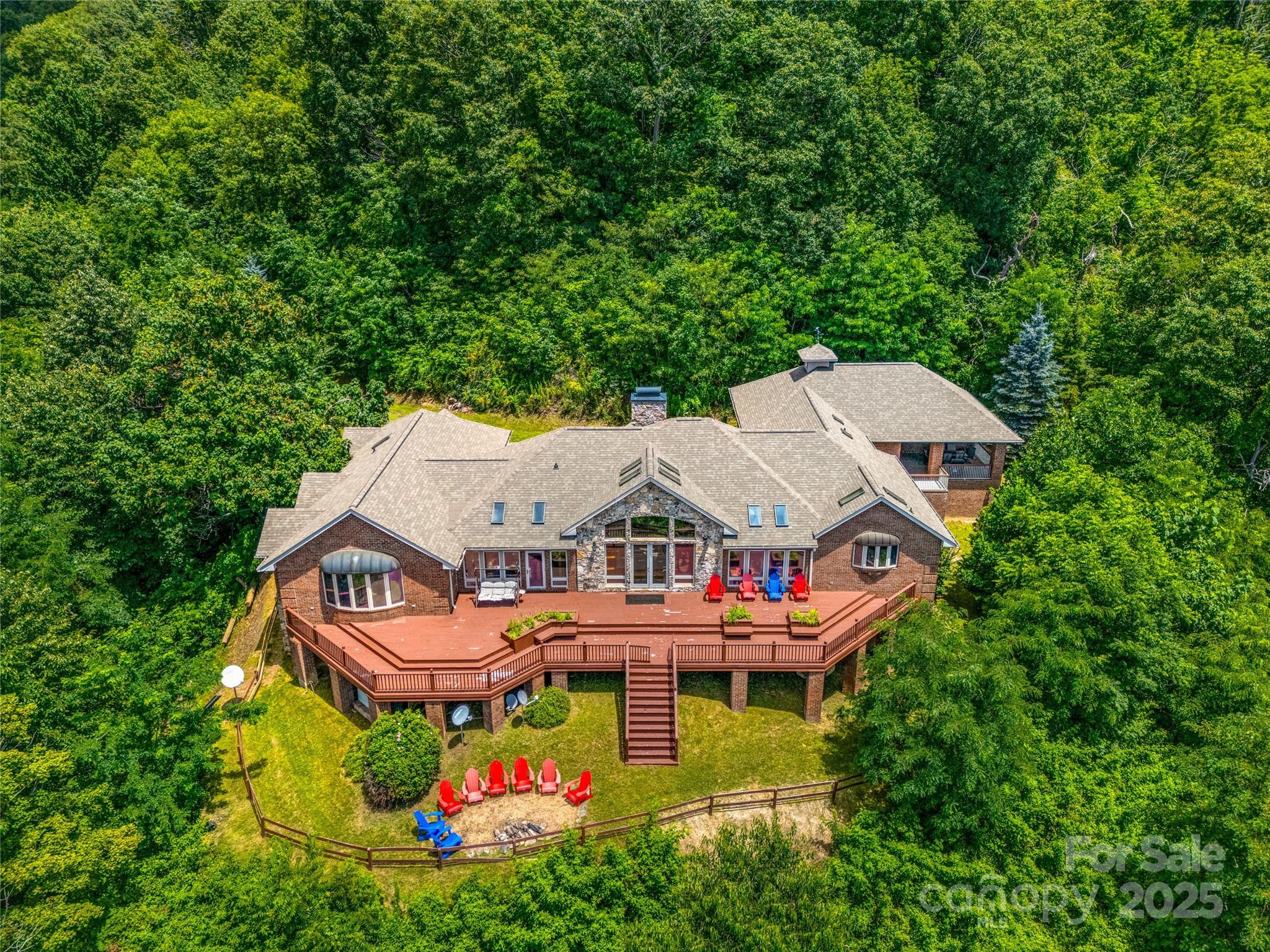 514 Lab Mountain Trail Clyde, NC 28721 - Photo 6 of 37 an aerial view of a house with swimming pool and garden