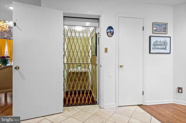 a view of living room with furniture and wooden floor
