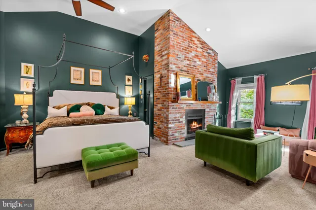a bath room with a granite countertop sink and a mirror
