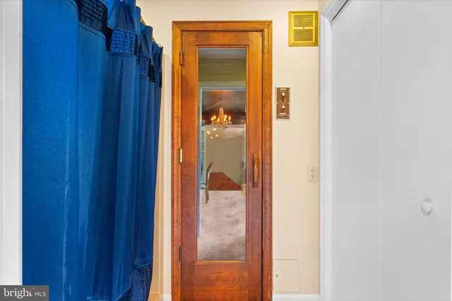 a view of a patio with table and chairs and potted plants