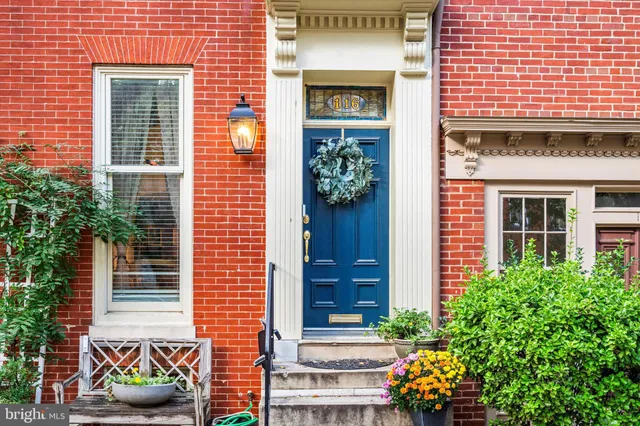 a view of a swimming pool with couches chairs and a fire pit