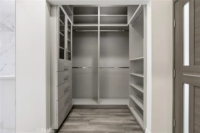 a white bath tub sitting next to a white sink