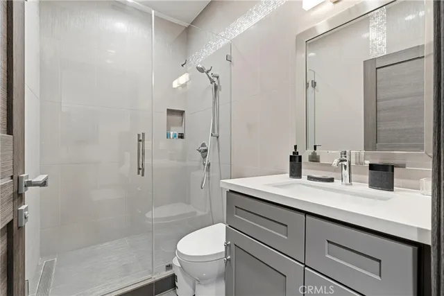 a bedroom with two beds and a window