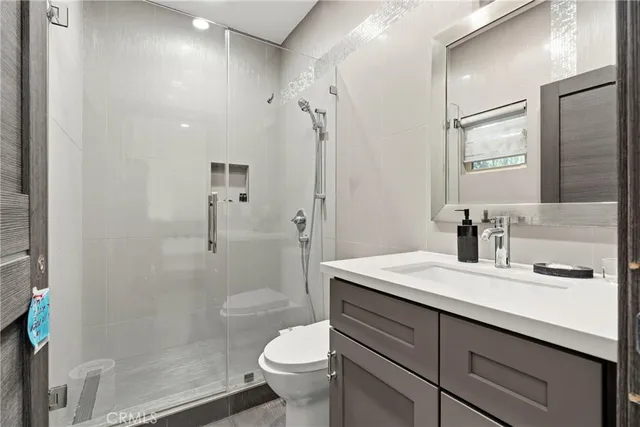 a kitchen with stainless steel appliances a refrigerator sink and cabinets