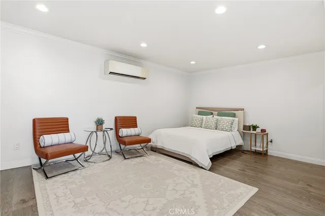 an aerial view of a house with a garden and swimming pool