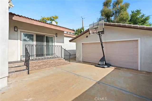 an aerial view of residential houses with city view