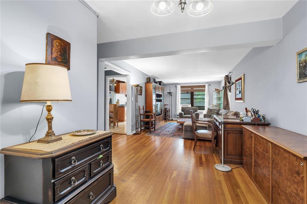 9511 Shore Road, Unit 313 Brooklyn, NY 11209 - Photo 3 of 11 a living room with furniture and wooden floor