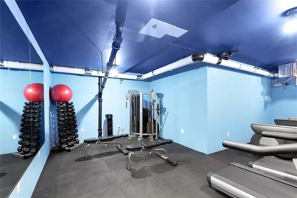9511 Shore Road, Unit 313 Brooklyn, NY 11209 - Photo 9 of 11 a view of a room with gym equipment