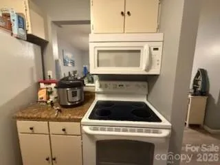 a kitchen with a stove and cabinets