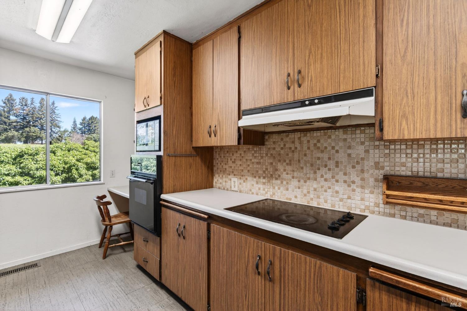 2062 Laguna Road Santa Rosa, CA 95401 - Photo 17 of 80 a kitchen with stainless steel appliances a sink a stove and cabinets