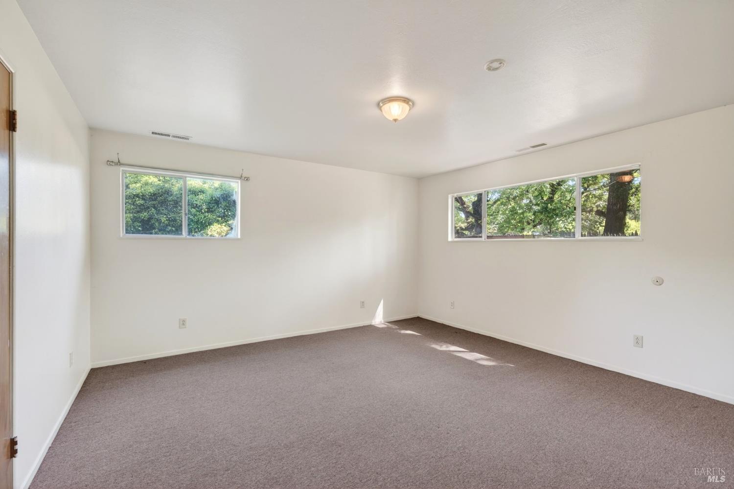 2062 Laguna Road Santa Rosa, CA 95401 - Photo 34 of 80 an empty room with windows