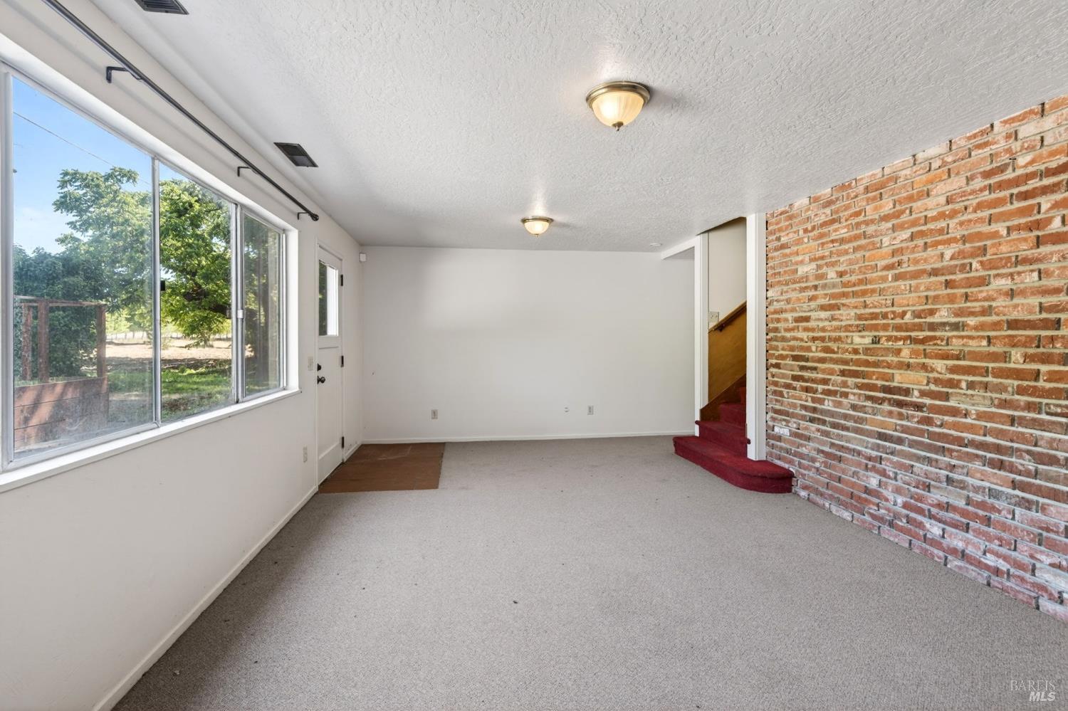 2062 Laguna Road Santa Rosa, CA 95401 - Photo 39 of 80 a view of an empty room with windows