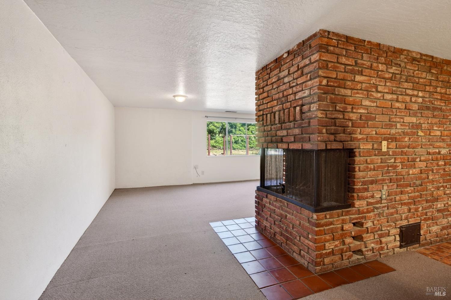 2062 Laguna Road Santa Rosa, CA 95401 - Photo 41 of 80 a living room with furniture and a fireplace
