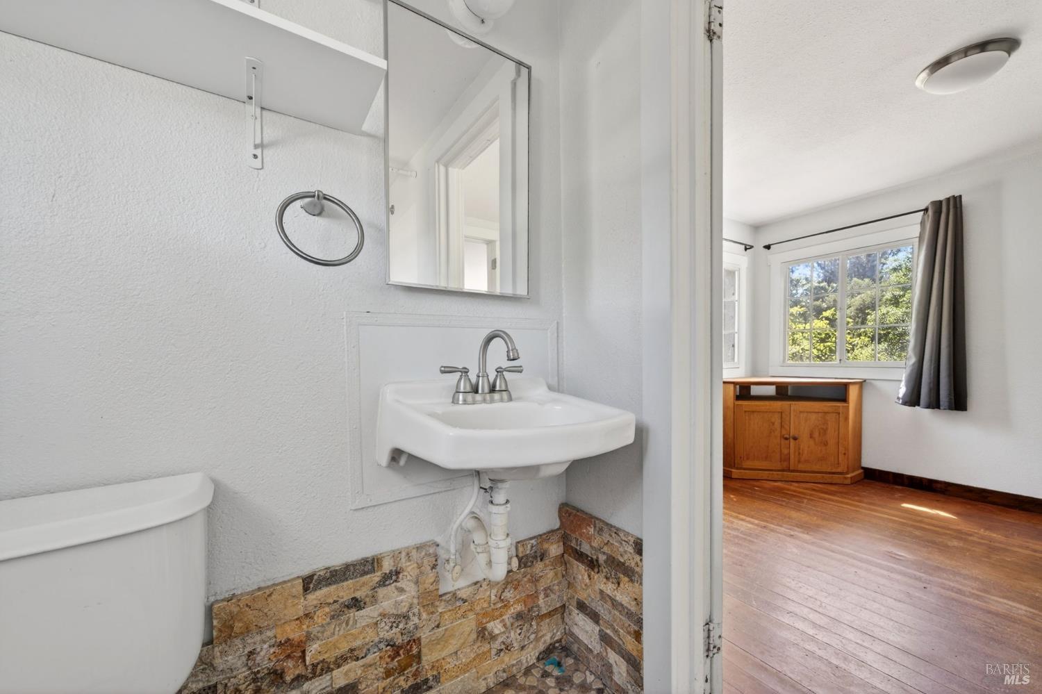2062 Laguna Road Santa Rosa, CA 95401 - Photo 60 of 80 a bathroom with a sink a toilet and a window