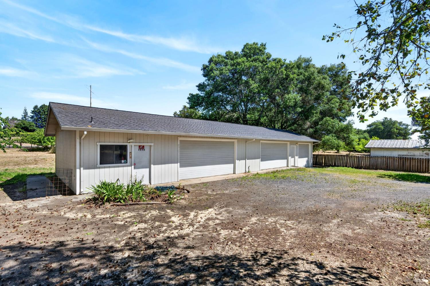 2062 Laguna Road Santa Rosa, CA 95401 - Photo 66 of 80 a view of a house with a yard and large tree