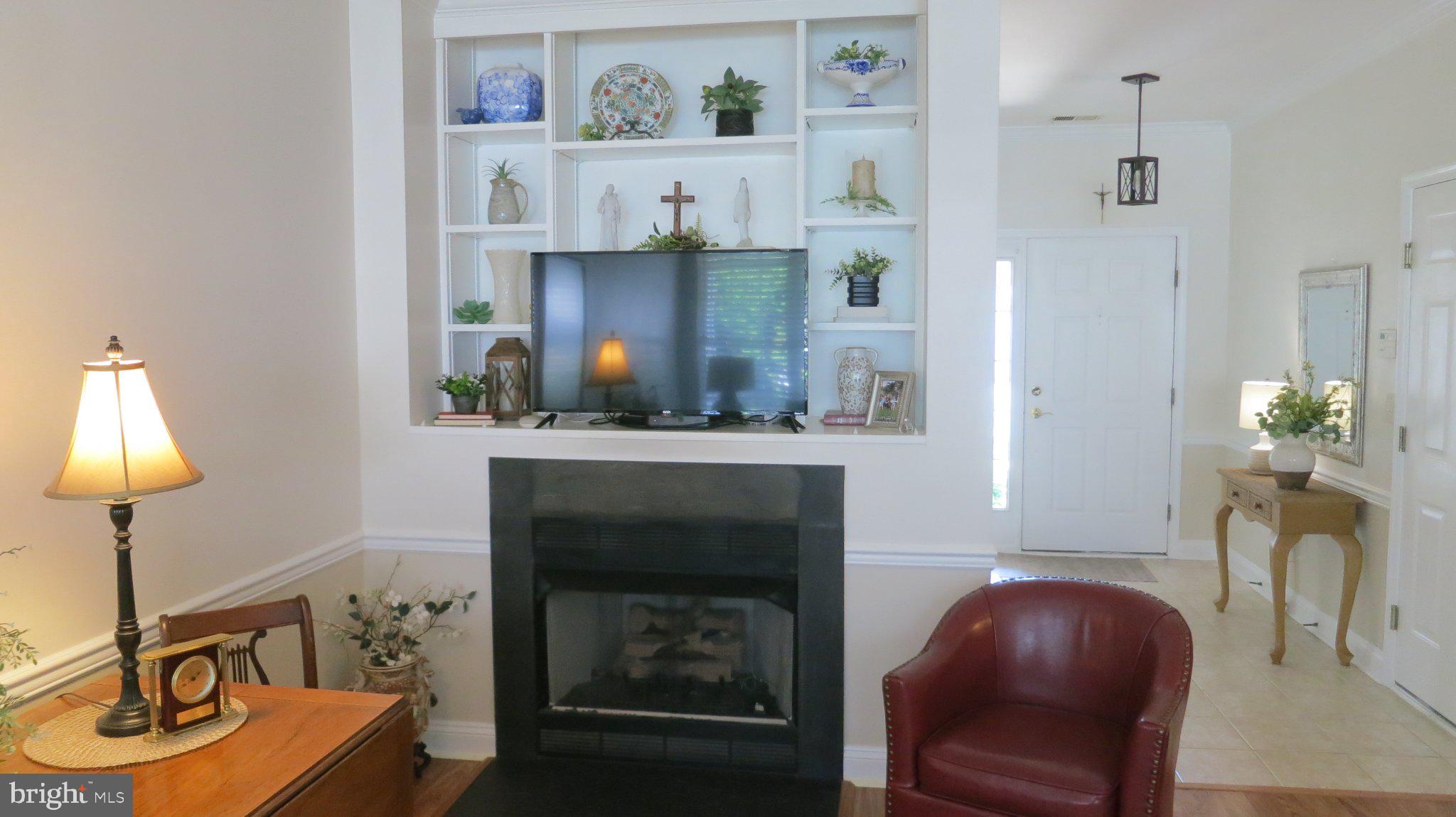 25 Chickadee Way Hamilton, NJ 08690 - Photo 8 of 26 a living room with furniture and a fireplace