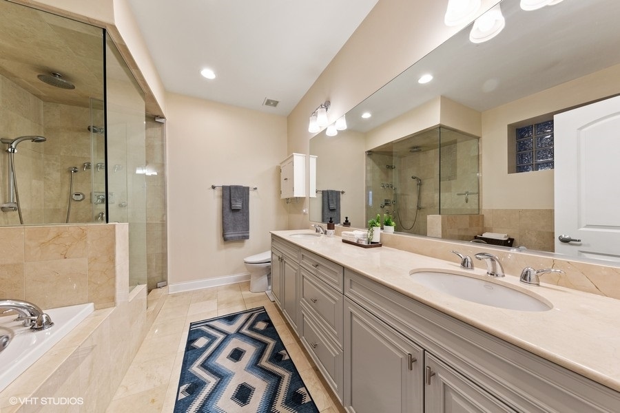2248 North Racine Avenue, Unit 1 Chicago, IL 60614 - Photo 12 of 27 a spacious bathroom with a double vanity sink mirror and shower