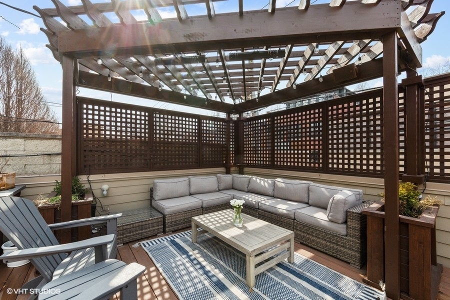 2248 North Racine Avenue, Unit 1 Chicago, IL 60614 - Photo 20 of 27 a roof deck with couches and potted plants