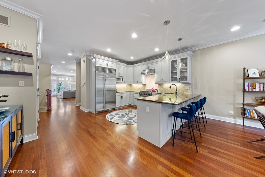 2248 North Racine Avenue, Unit 1 Chicago, IL 60614 - Photo 8 of 27 a living room with furniture and kitchen view