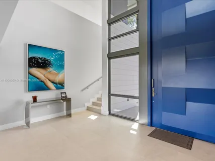 a living room with furniture ceiling fan and a rug