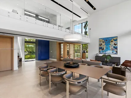 a view of living room with furniture and floor to ceiling window