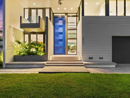 a view of front door of house with stairs