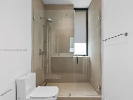 an aerial view of a house with a yard basket ball court and outdoor seating