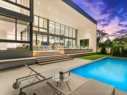 a view of a white house with a large windows